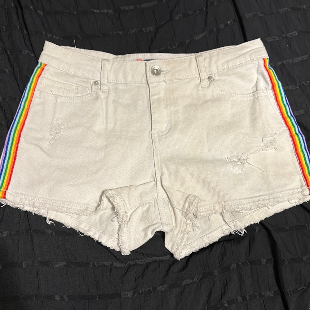 White jean shorts with rainbow stripes on side